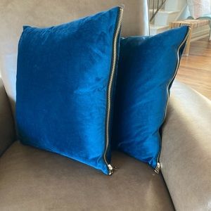 Blue velvet accent pillows with gold zipper